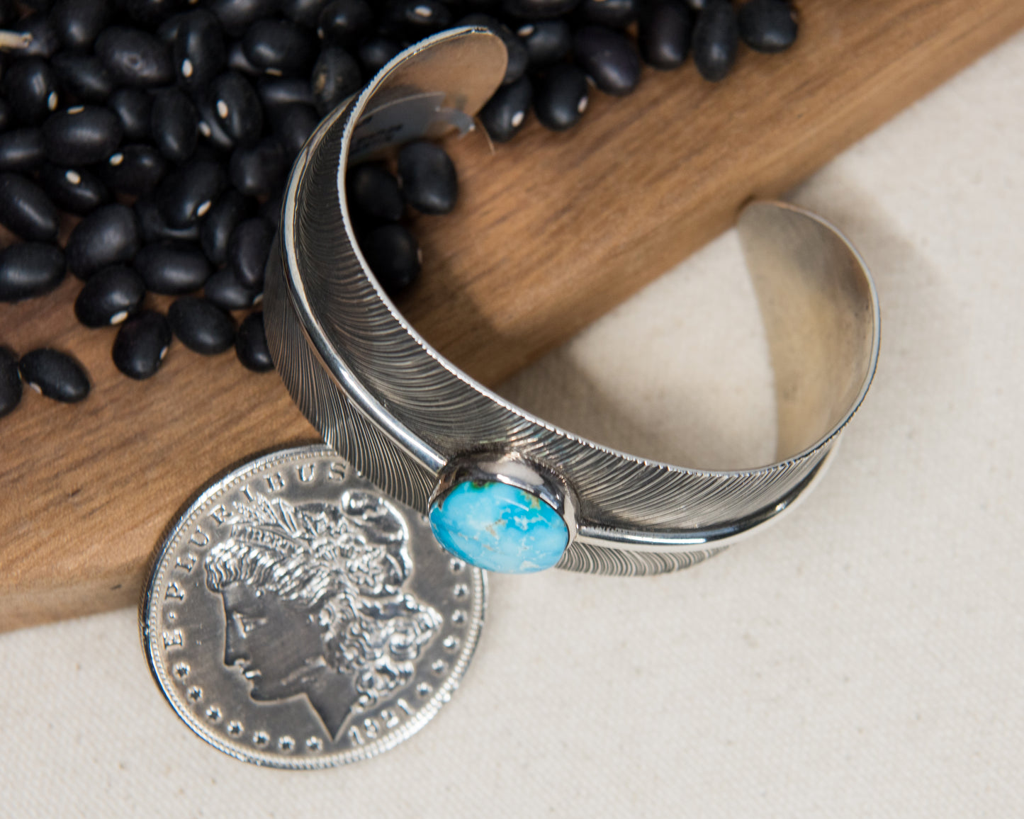 Kingman Turquoise Stamped Feather Cuff